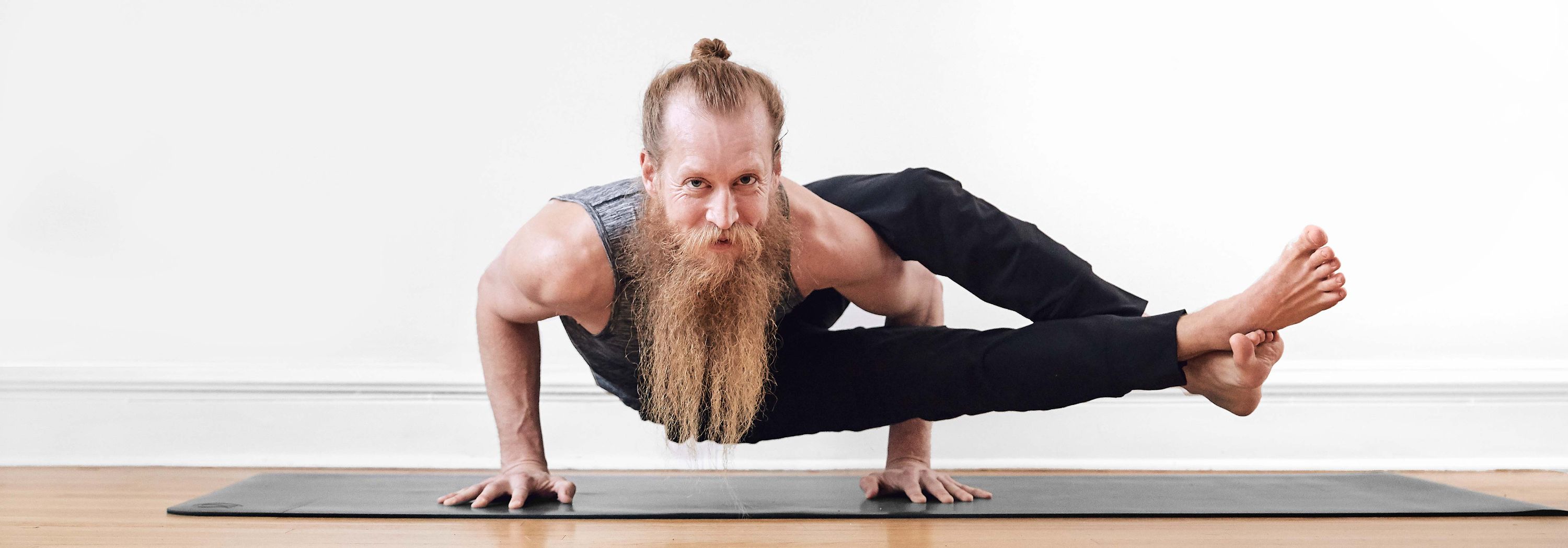 Ryan Leier in yoga arm balance